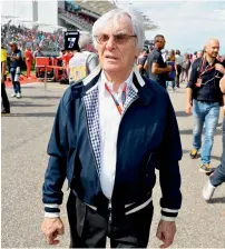  ?? AFP ?? Bernie Ecclestone walks on the grid. —