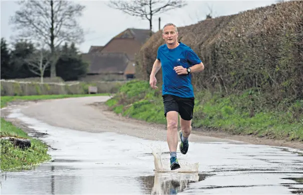  ??  ?? Stamina man: Richard Dunwoody trains along the country lanes of Berkshire in readiness for his outing in the North Korea marathon; (below) winning the 1994 Grand National on Miinnehoma