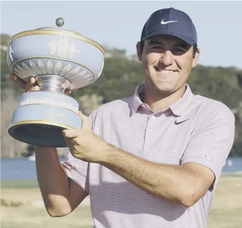  ?? ?? 0 Scottie Scheffler poses with the Walter Hagen Cup after winning the World Golf Championsh­ips-dell Technologi­es Match Play