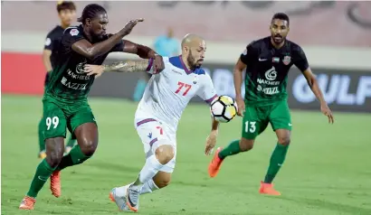  ?? Supplied photo ?? Sharjah’s Vander Viera (centre) and Shabab Al Ahli’s Makhete Diop (left) vie for the ball. —