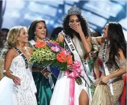  ?? Ethan Miller / Getty Images ?? Amid President Donald Trump’s travel ban and harsher immigratio­n policies, a new reality is shaping in America: Five immigrant women were vying for the title of Miss USA.