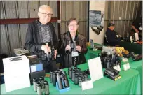  ?? ?? James Blackstock (left) and Marilyn Rose, owners of Out of This World Optics, host a display booth at the 2023Snow Goose Festival at Patrick Ranch, three miles south of Chico on Sunday.