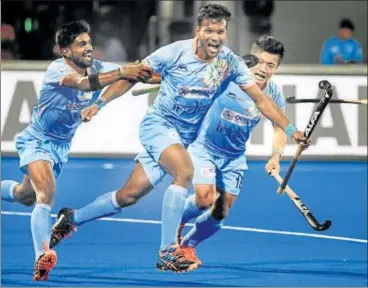  ?? AFP ?? Amit Rohidas (centre) celebrates after scoring against Canada in the hockey World Cup in Bhubaneswa­r on Saturday.