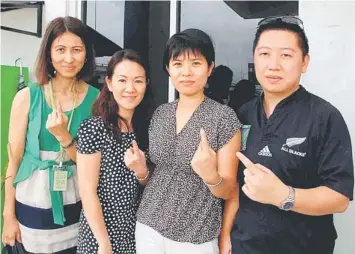  ??  ?? THE PROOF: (From right) Majimbun, Pan, Wong and another friend showing their completely clean left index fingers yesterday.