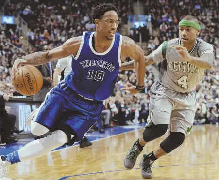  ?? AP PHOTO ?? NO STOPPING HIM: Isaiah Thomas tries to keep up with DeMar DeRozan during the Celtics’ loss to the Raptors last night in Toronto.