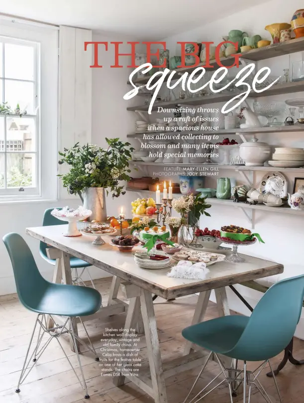  ??  ?? Shelves along the kitchen wall display everyday, vintage and old family china. At Christmas, homeowner Celia frosts a dish of fruits for the festive table on one of her glass cake stands. The chairs are Eames DSR from Vitra.