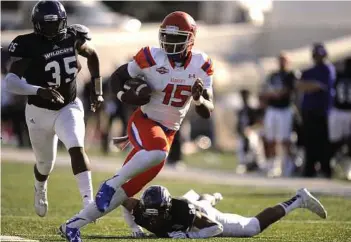 ?? Tommy Metthe / Abilene Reporter-News ?? Sam Houston State quarterbac­k Jared Johnson runs past Abilene Christian cornerback Jabari Butler on Oct. 17. SHSU faces McNeese State on Saturday.