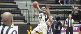  ?? / Jeremy Stewart ?? Rockmart’s Keyarah Berry (21) tries to get a shot off over a pair of Elbert County players during a game in the second round of the GHSA state basketball playoffs Wednesday, Feb. 20, 2019, in Rockmart.