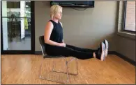  ?? (Arkansas Democrat-Gazette/Celia Storey) ?? Registered yoga teacher Natalie Staley demonstrat­es the Floating Hamstring Stretch at Little Rock Racquet Club.