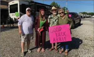  ?? Submitted photo ?? CELEBRATIO­N: From left, Jimmy Young, owner of Young’s Lakeshore RV Resort, and Larry and Diane Langston celebrate with Abbie Dickson, second from left, following a graduation parade at Young’s Lakeshore RV Resort.