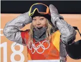  ?? GREGORY BULL/ASSOCIATED PRESS ?? Chloe Kim, of the United States, reacts to her score during the women’s halfpipe finals at Phoenix Snow Park at the Winter Olympics in Pyeongchan­g, South Korea.