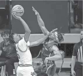  ?? RON JENKINS/AP ?? Memphis guard Boogie Ellis (5) shoots over Boise State guard Marcus Shaver Jr. (0) during the first half of the semifinals of the NIT.