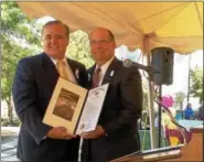  ?? LISA MITCHELL - DIGITAL FIRST MEDIA ?? Rep. Gary Day presents a citation to Kutztown University President Dr. Kenneth Hawkinson during the 150th birthday party on Sept. 15.