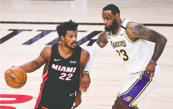  ?? DOUGLAS P. DEFELICE / GETTY IMAGES ?? In posting a 40-point triple-double on Sunday against LeBron James and the Los Angeles Lakers, Miami's Jimmy Butler showed observers he is one of the keys to the series.