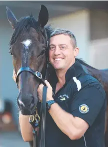  ?? Picture: ANNETTE DEW ?? Trainer Tony Gollan with EF Troop.