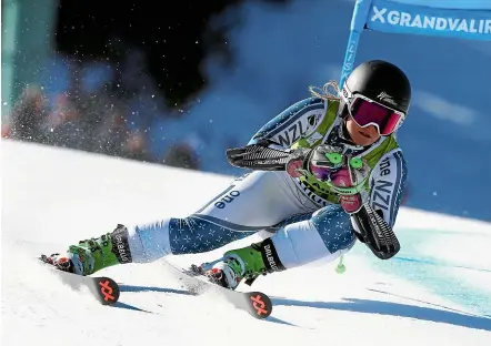  ?? AP ?? New Zealand’s Alice Robinson flies down the mountain in her first run of the women’s alpine ski giant slalom.