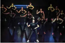  ??  ?? Participan­ts perform during a ‘bootcamp’ workshop conducted by Lido dancer Victoria on the stage of the Lido cabaret in Paris.