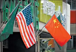  ?? GREG BAKER/GETTY-AFP ?? A U.S. Chamber of Conference official who has been briefed by both sides, says the U.S. and China are close to finalizing a Phase 1 trade agreement.