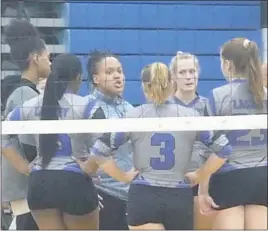  ?? STAFF PHOTO BY ANDY STATES ?? Lackey head volleyball coach Jo’nel Barnes talks with her team during a timeout in its match at Huntingtow­n on Monday. The Chargers fell in three sets.