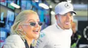  ?? GETTY IMAGES ?? ▪ Popstar Christina Aguilera with Lewis Hamilton after the Formula One driver won the Azerbaijan Grand Prix on Sunday.