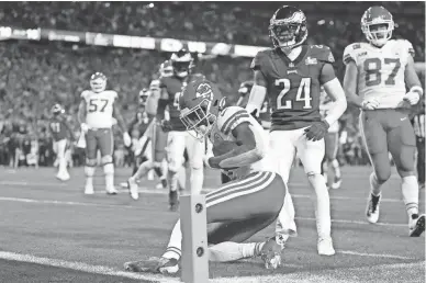  ?? AP ?? Chiefs running back Jerick McKinnon purposely stops short of the goal line on a run against the Eagles late in Super Bowl 57 on Sunday in Glendale. The move allowed the Chiefs to run down the clock before kicking the go-ahead field goal.