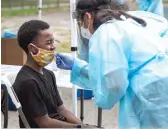  ?? ANTHONY VAZQUEZ /SUN-TIMES FILE ?? Jabari Leeper gets tested for COVID-19 at a mobile COVID-19 testing station at Edward Coles School earlier this month.