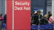  ?? TERESA CRAWFORD — THE ASSOCIATED PRESS ?? Passengers check in for their flights in 2016near a security checkpoint sign at O’hare Internatio­nal Airport in Chicago.
