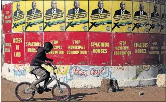  ?? PHOTO: SANDILE NDLOVU ?? The ANC and EFF held their election campaigns at Ga-Seleka in Lephalale, Limpopo, at the weekend. A young boy cycles past their posters yesterday