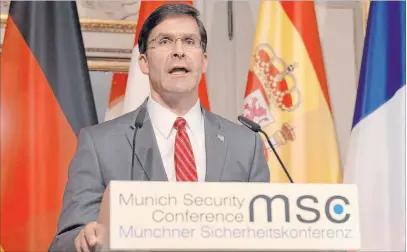  ?? Jens Meyer The Associated Press ?? Defense Secretary Mark Esper speaks during a press conference Friday in Munich, Germany. Esper responded to a reporter’s question about criticism from Democrats and Republican­s in Congress over funding of border wall constructi­on.