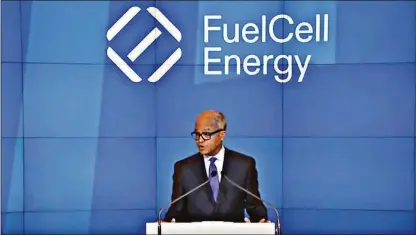  ?? Contribute­d photo ?? FuelCell Energy CEO Jason Few speaks on June 7 as part of the ceremonial opening bell for the Nasdaq. The National Labor Relations Board is investigat­ing a complaint by union workers that the company retaliated for organizing efforts.