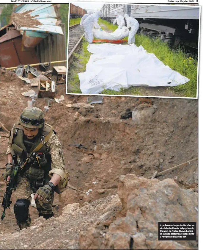  ?? ?? A policeman inspects site after an air strike by Russia in Lysychansk, Ukraine, on Friday. Above, bodies of Russian soldiers are loaded into a refrigerat­ed railroad car.