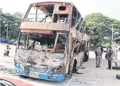  ?? CHAKKRAPAN NATANRI ?? This bus went up in flames as it was heading to Bangkok, killing five passengers in Ban Haet district of Khon Kaen yesterday.