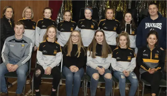  ??  ?? The under-14 team with coaches Jackie Furlong and Kevin Bates at the event in Raheen Hall. FOR MORE PICTURES, SEE THIS WEEK’S SPORT SECTION