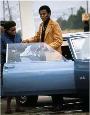  ?? Picture: Arena Holdings archive ?? Kaizer Motaung with his sporty Ford Mustang in the 1970s. Reminiscin­g about the apartheid years, he says the first thing the ‘Afrikaner policemen’ asked him at a roadblock was: ‘Whose car is this?’