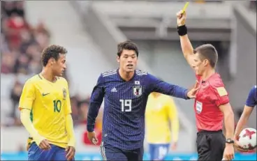  ?? AP ?? Brazil's Neymar (left) was booked for cuffing Japan's Hiroki Sakai on the head during a friendly game at Lille on Friday.