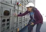  ?? CARLOS OSORIO/TORONTO STAR FILE PHOTO ?? Anita Krajnc examines a truck carrying pigs in 2012. She was cleared of a mischief charge on Thursday.