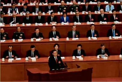  ?? PEDRO PARDO/AFP VIA GETTY IMAGES ?? China’s Premier, Li Qiang, delivered a summary report during the meeting’s opening session in Beijing Tuesday, acknowledg­ing the challenges China is facing.