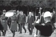  ?? AP/ LEFTERIS PITARAKIS ?? U. S. Secretary of State Rex Tillerson ( center) prepares to lay a wreath at the mausoleum of Turkey’s founder, Mustafa Kemal Ataturk, in Ankara on Thursday.