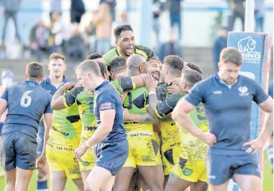  ?? PHOTO BY DEAN WILLIAMS ?? Jamaica players celebrate Jordan Andrare’s try during their Rugby League Internatio­nal against Scotland at Millennium Stadium, Feathersto­ne, England on Sunday.