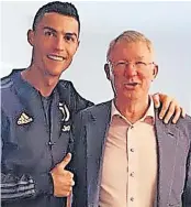  ?? ?? SAME SIDE Man Utd legends Ronaldo and Ferguson