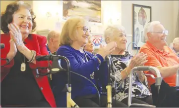  ?? Ryan Mancini/The Signal ?? Mary Anne Rhart, left, along with Rose Salamona, Louise Pinsky and veteran David Charlberg watch as Michael Quest performs at Oakmont of Santa Clarita’s Veterans Day celebratio­n on Sunday.