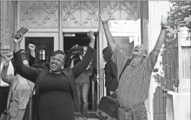  ?? SUE OGROCKI AP PHOTO ?? Johnny Tallbear, right, celebrates outside the Oklahoma County Courthouse with one of his attorneys, Karen Thompson, left, in Oklahoma City, Monday, June 11, 2018, after Judge Glen Jones ordered his release due to new DNA evidence. Tallbear had been...