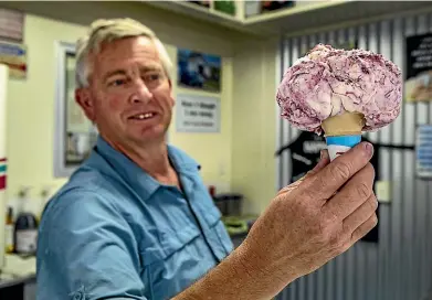  ?? JOHN KIRK-ANDERSON/STUFF ?? Size matters: A single scoop of icecream from Errol Barnes at the Darfield Dairy.