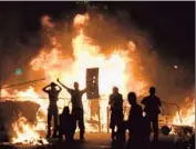  ?? Lluis Gene
Afp/getty Images ?? UNREST IN BRAZIL has helped fuel a 14% drop in the broad MSCI emerging-markets index this year. Above, demonstrat­ors in Rio de Janeiro last month.