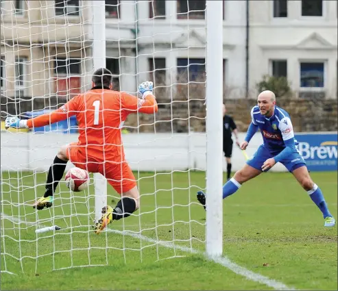  ??  ?? HEADS WE WIN: Lancaster City’s Sam Bailey plants a header past Matt Coton to make it 2-0