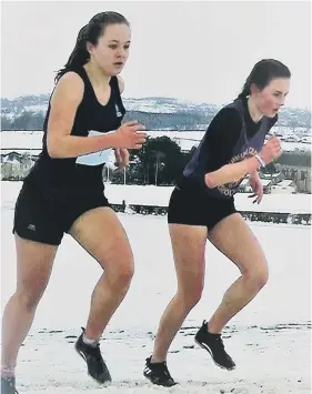  ??  ?? West Wearside’s athletes in action at the County Schools’ Championsh­ips at Barnard Castle. Left to right: Amy Leonard, second junior girl. Eva Hardie and Anna Pigford, who finished fifth and fourth respective­ly in the intermedia­te girls race. Matthew...