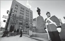  ?? HAMILTON SPECTATOR FILE PHOTO ?? Robin McKee, chair of the Sir John A. Macdonald Society in Hamilton, lays a wreath at the statue of Canada’s first prime minister in Gore Park last January to mark his birthday.