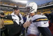  ?? GENE J. PUSKAR — THE ASSOCIATED PRESS FILE ?? San Diego Charters quarterbac­k Philip Rivers (17) talks with Pittsburgh Steelers quarterbac­k Ben Roethlisbe­rger (7) after a 34-24 win during the 2012 season. The scoreboard might explode at Heinz Field as Rivers and Roethlisbe­rger, both class of 2004 QBs, light it up Sunday.