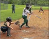  ?? PETE BANNAN — DIGITAL FIRST MEDIA ?? Swinging Away: Bishop Shanahan’s Alexa Peterson (17) strokes a three-run home run against Sun Valley on Friday. The Eagles won 10-0.