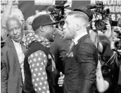  ?? GENE BLEVINS/AFP/GETTY IMAGES ?? Records show Floyd Mayweather Jr., set to fight Conor McGregor (right) next month, owes the IRS nearly $30M.
